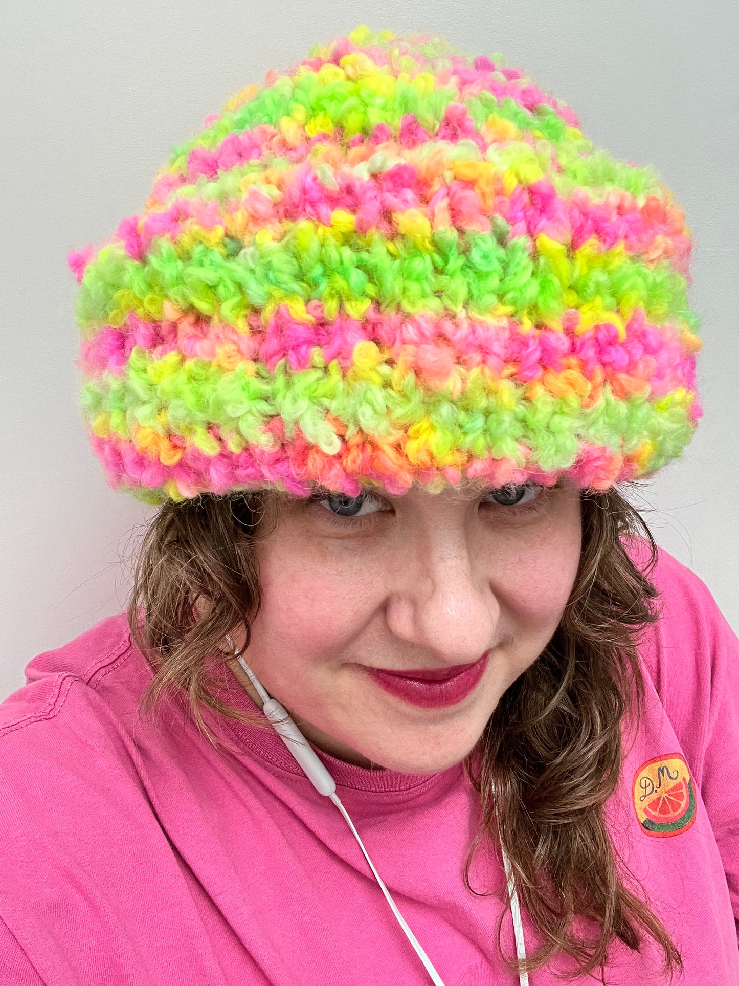 Helen wearing the a hat made in Teddy in the Garden from the Chunky Boucle collection by the hand dyed yarn expert, The Wool Kitchen
