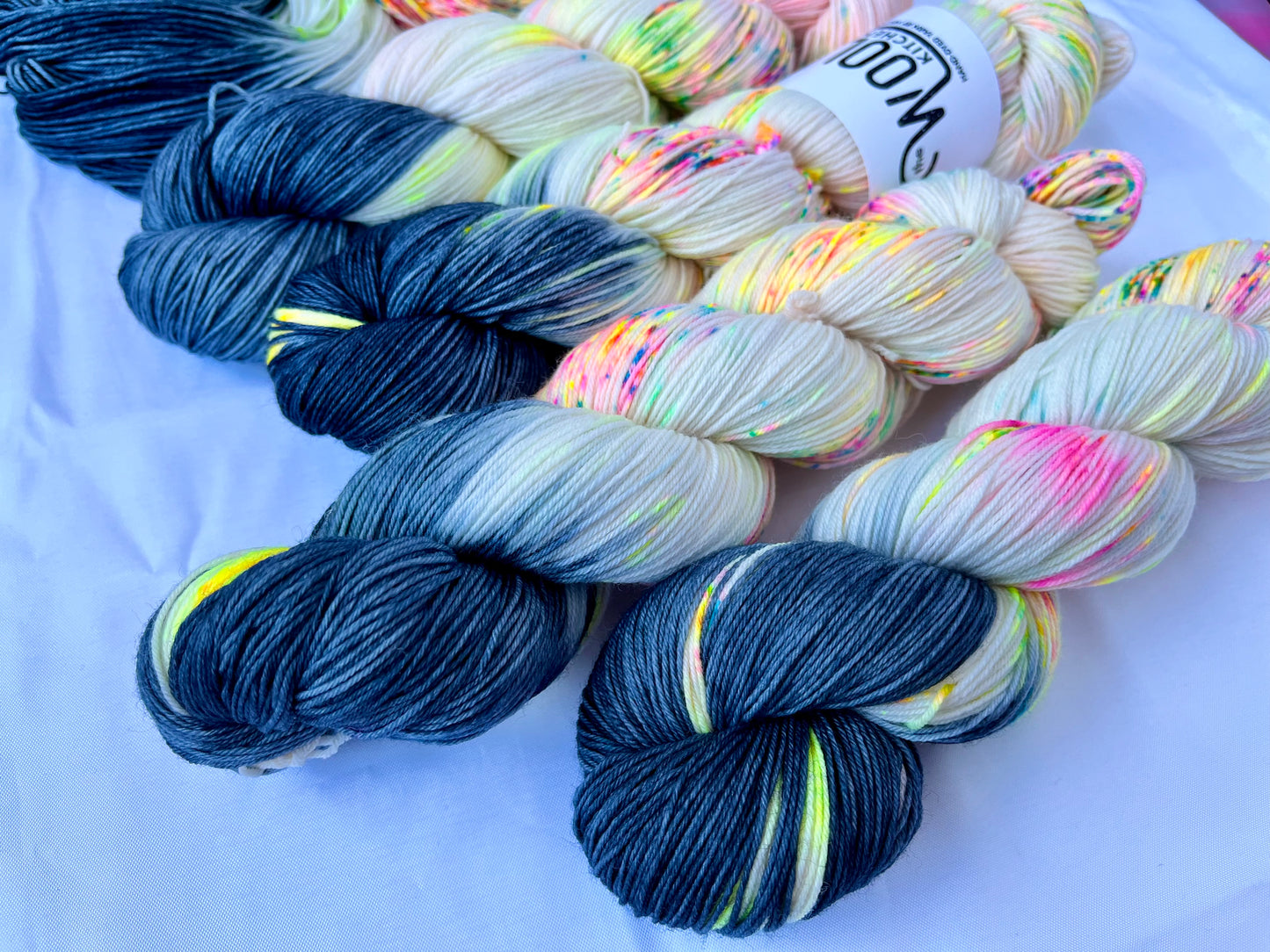 Close up of the Reverse Pops Grey Zip Yarn from the 4ply sock collection by the hand dyed yarn expert, The Wool Kitchen.