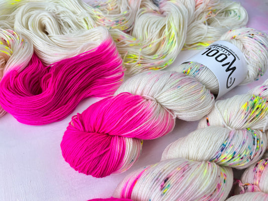 Close up of Reverse Pops Grey Zip Yarn from the 4ply sock collection by the hand dyed yarn expert, The Wool Kitchen.