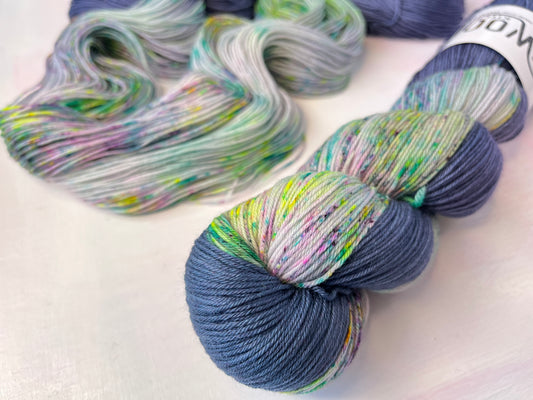 Close up of the zip (coloured section) of Stardust Long Zip Assigned Pooling Long Zip Yarn 4ply Merino Sock from the hand dyed yarn expert, the Wool Kitchen