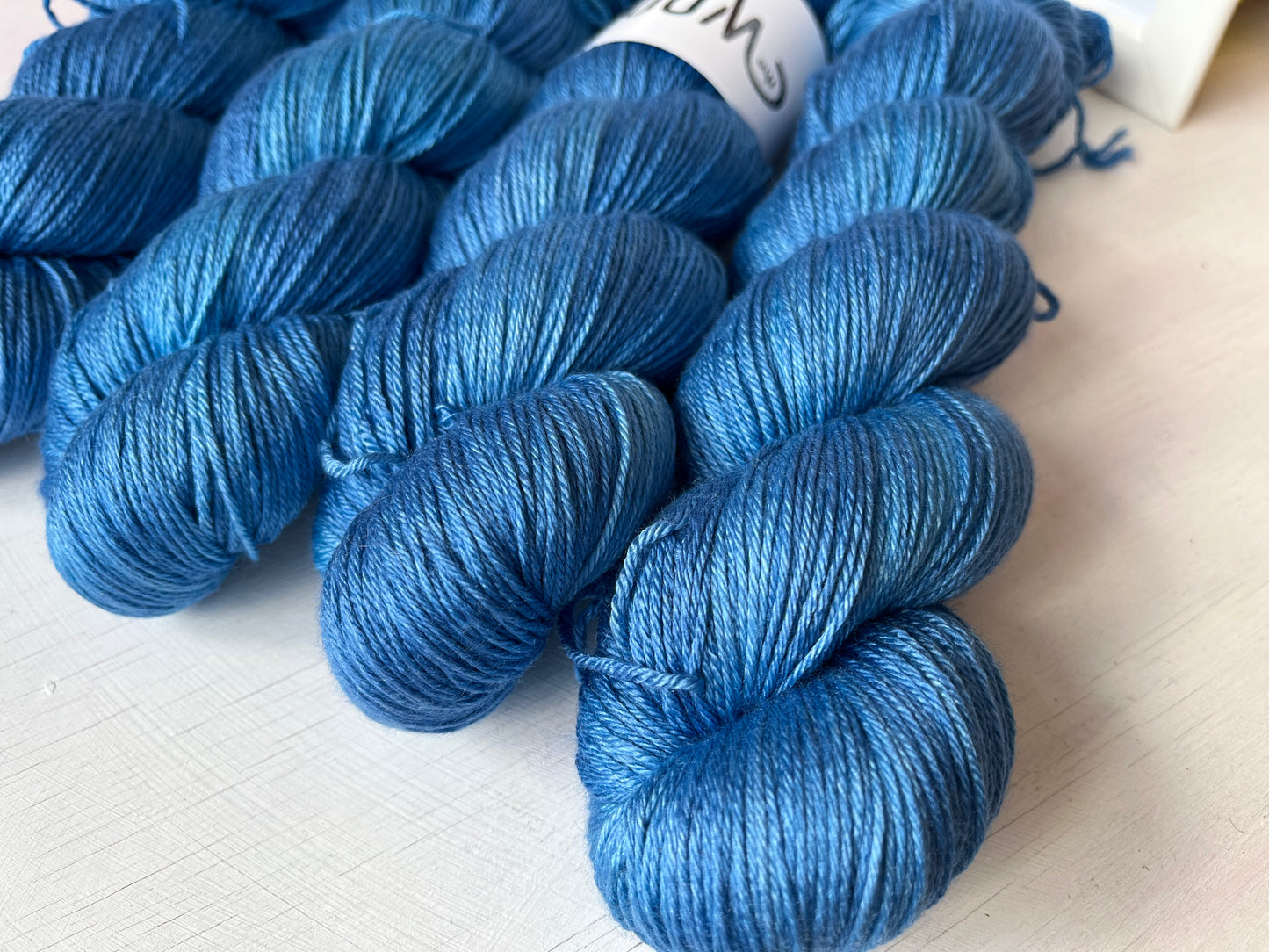 Close up of September Skies Luxury 4ply Merino Silk yarn from the hand dyed yarn expert, The Wool Kitchen.