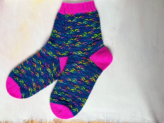 Zip Wave Sock by Nicola Furey in Cosmic Girl Dark 4ply Sock Yarn and Geek mini skein by the hand dyed wool expert, The Wool Kitchen. 