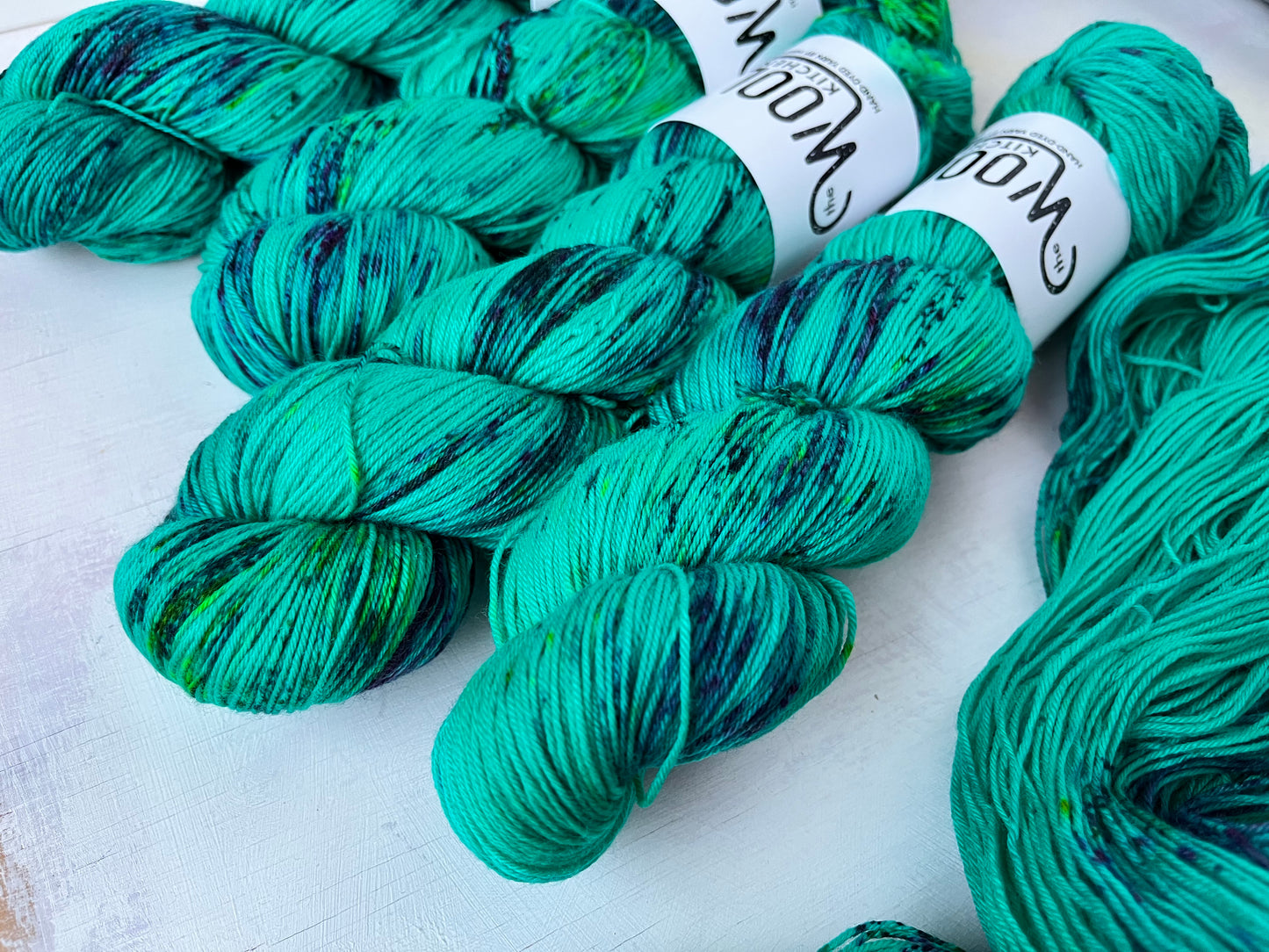 Close up of Mystic Green yarn from the 4ply sock yarn collection by the hand dyed yarn expert, The Wool Kitchen.