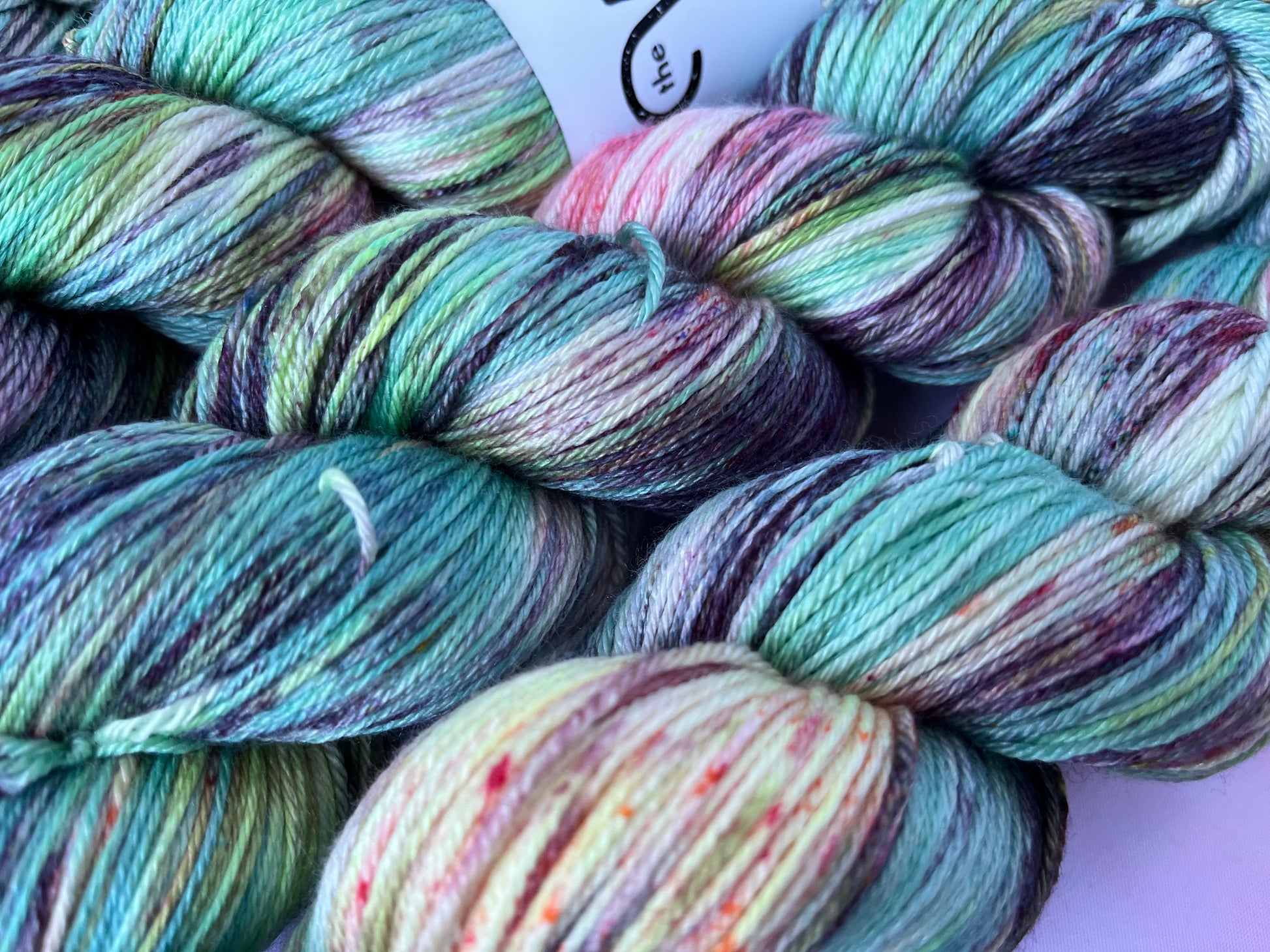 Extreme close up of the hand dyed yarn in Image 3 on Luxury 4ply Merino Silk yarn from the Seashells Monthly Yarn club by the hand dyed yarn expert, The Wool Kitchen. 