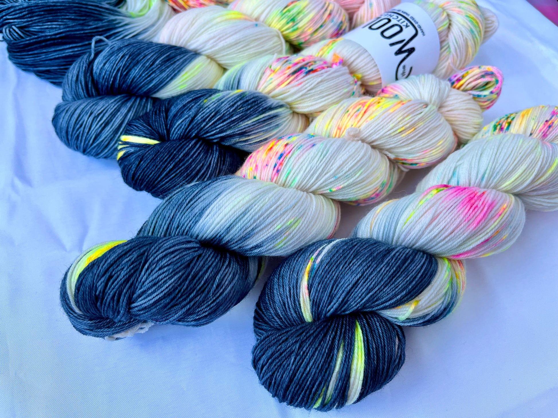 Close up of the Reverse Pops Grey Zip Yarn from the 4ply sock collection by the hand dyed yarn expert, The Wool Kitchen.