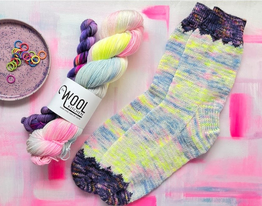Summer Solstice sock set from the 4ply sock yarn collection by the hand dyed yarn expert, The Wool Kitchen. Featuring a pair of Solstice socks designed by Helen Reed.
