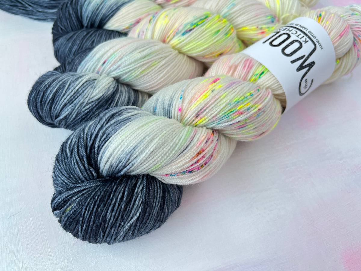 Close up of Reverse Pops Grey Zip Yarn from the 4ply sock collection by the hand dyed yarn expert, The Wool Kitchen.