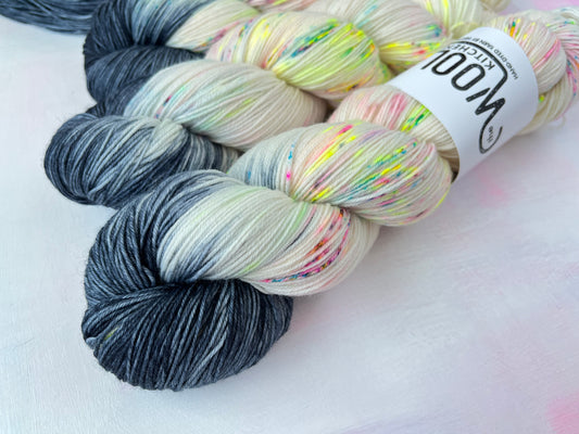 Close up of Reverse Pops Grey Zip Yarn from the 4ply sock collection by the hand dyed yarn expert, The Wool Kitchen.