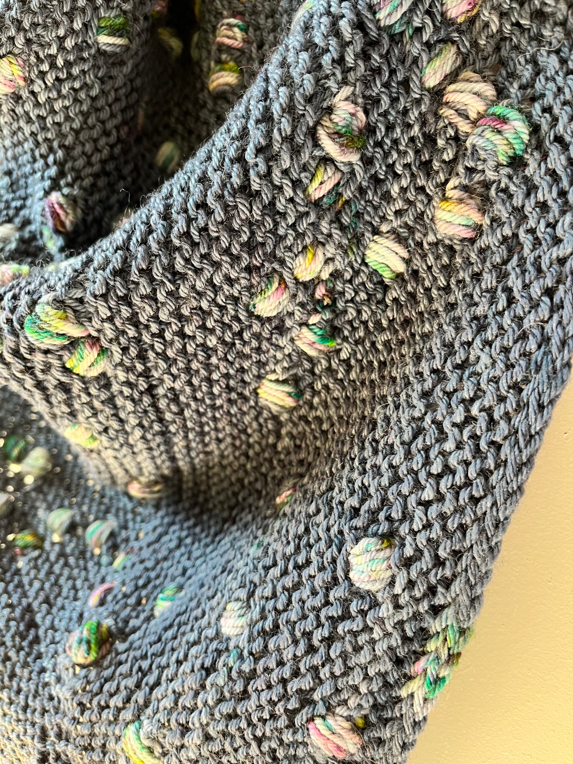Close up of the Loop Pop Shawl assigned pooling pattern shown in Stardust BFL DK Wool from the hand dyed yarn expert, The Wool Kitchen.