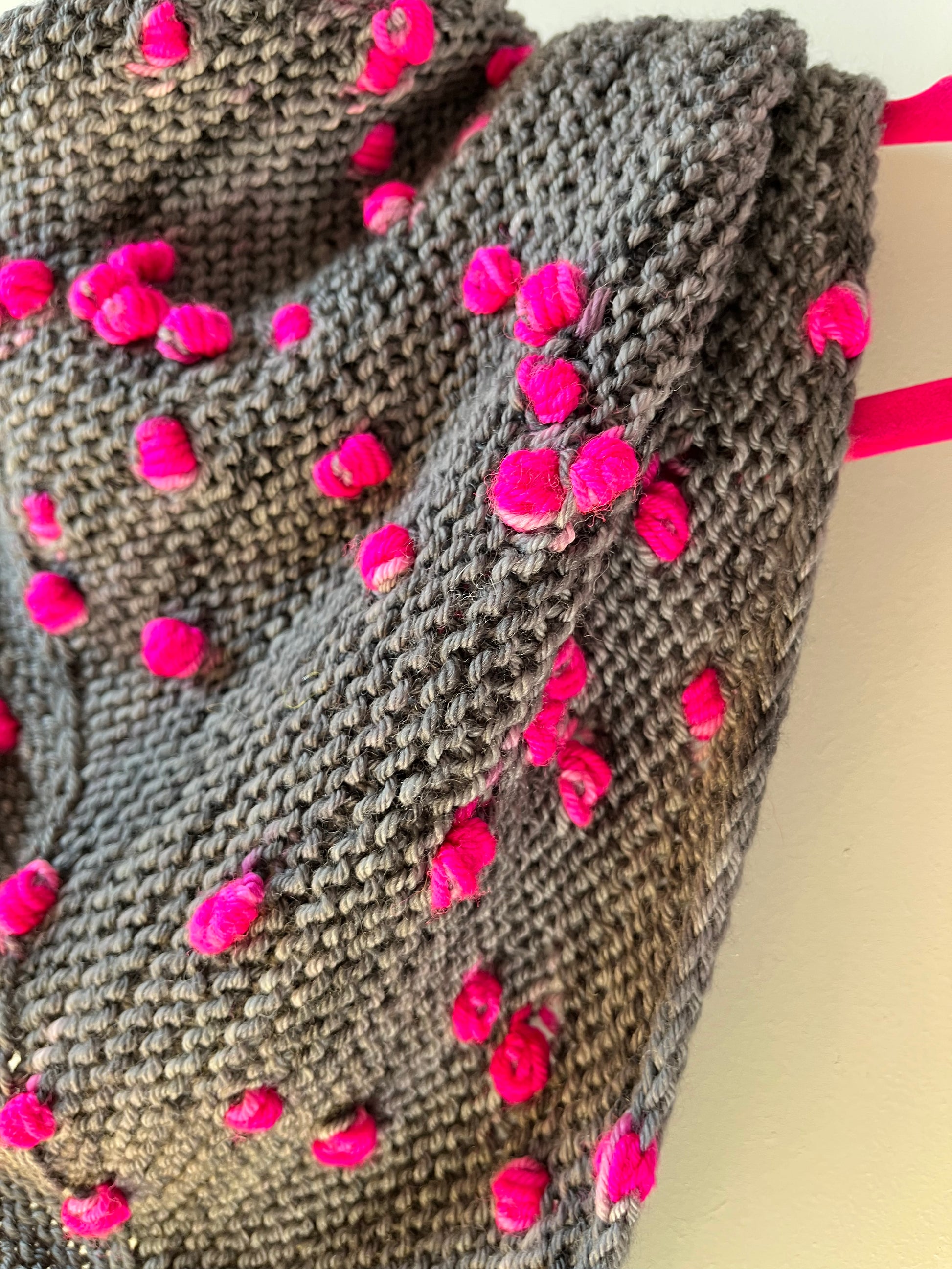 Close up of the Loop Pop Shawl assigned pooling pattern shown in Pink Pop BFL DK Wool from the hand dyed yarn expert, The Wool Kitchen.