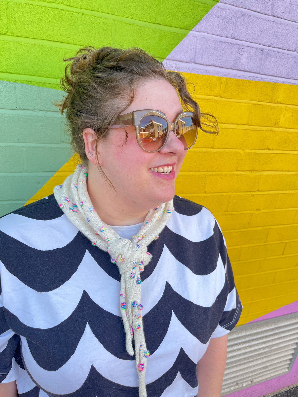 Front View of 101 Assign It Bandana Pattern by Helen Reed in Champagne Supernova Zip Yarn on 4ply Sock from the Wool Kitchen. Modelled by Helen.
