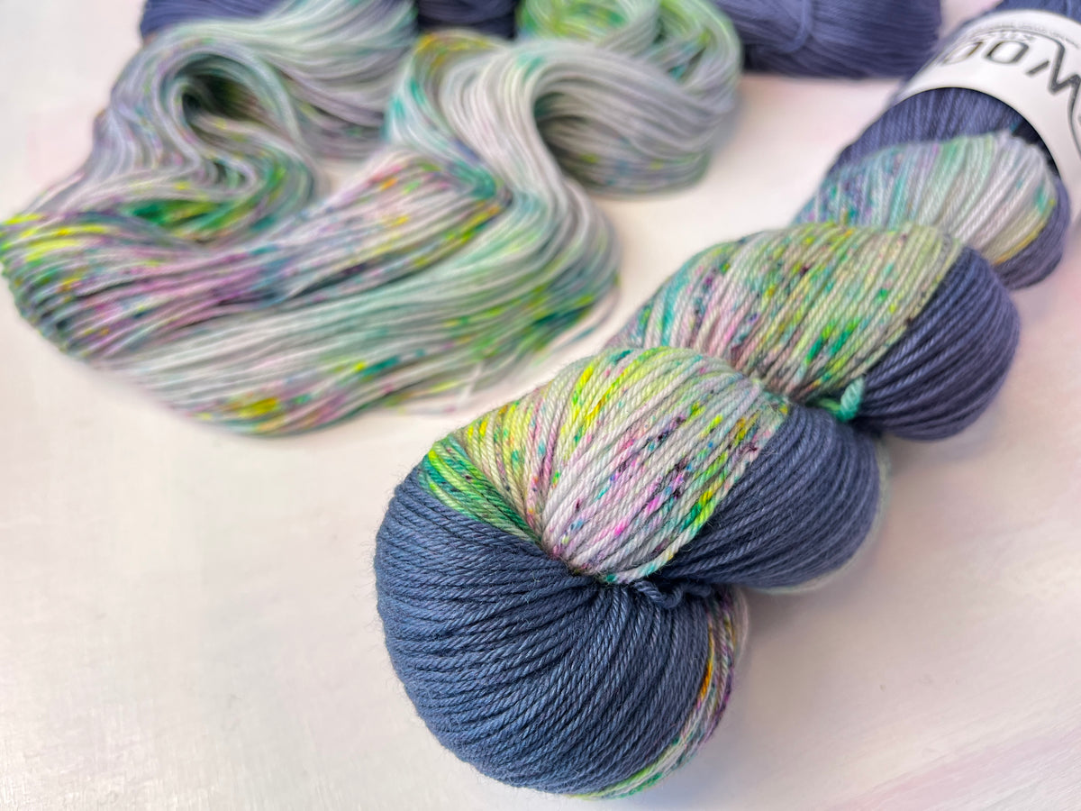 Close up of the zip (coloured section) of Stardust Long Zip Assigned Pooling Long Zip Yarn 4ply Merino Sock from the hand dyed yarn expert, the Wool Kitchen